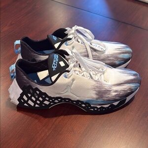 Jordan TRunner NXT in White and Black with Blue Accents